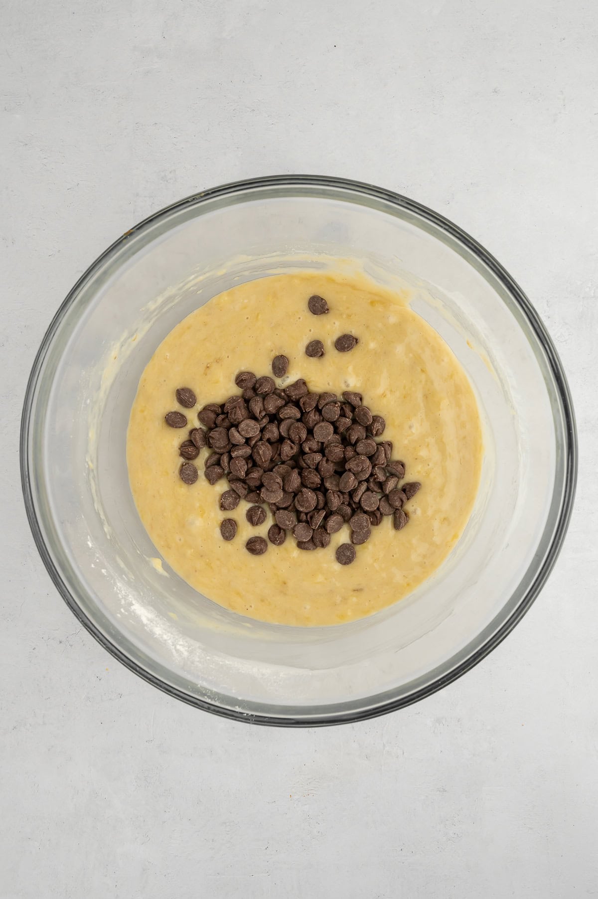 Folding chocolate chips into batter.