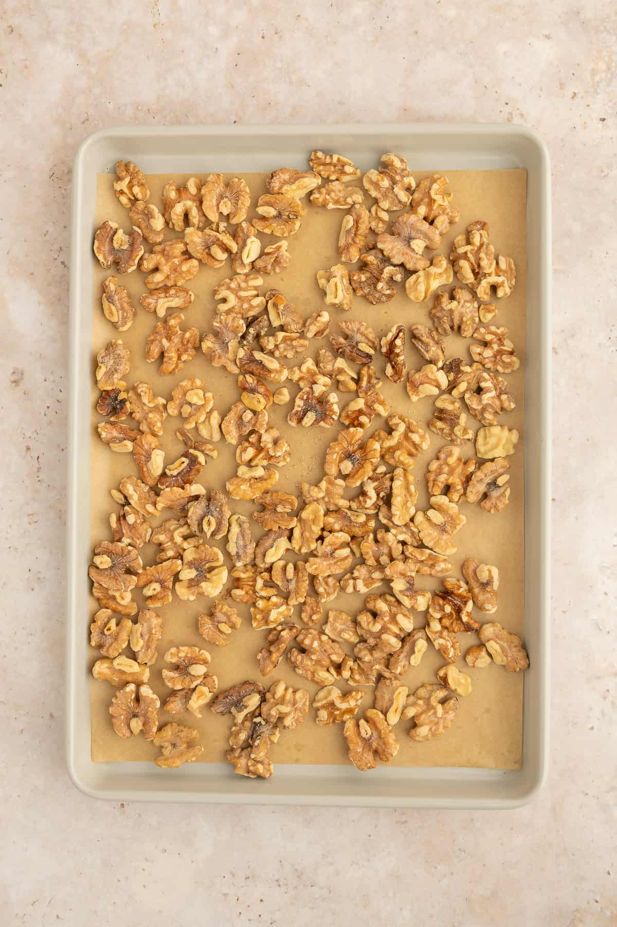 Walnuts roasted on a sheet pan.