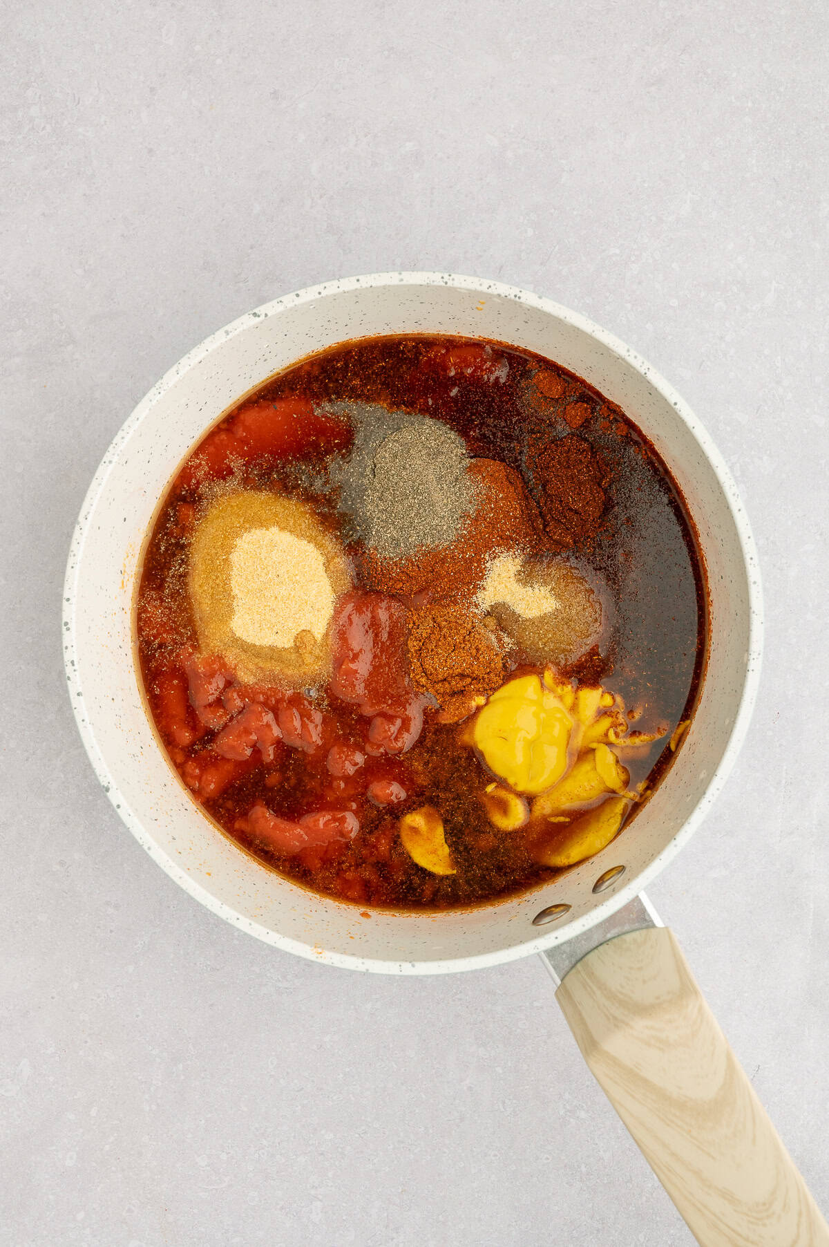 Ingredients for paleo BBQ sauce in a saucepan.