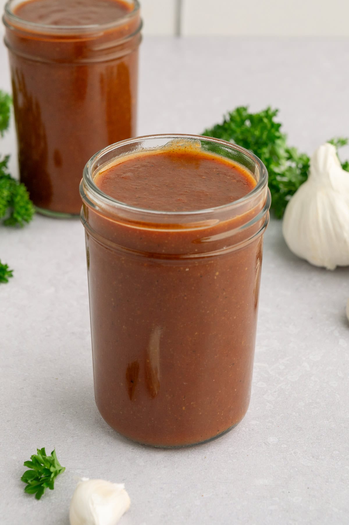 Mason jars of paleo BBQ sauce.