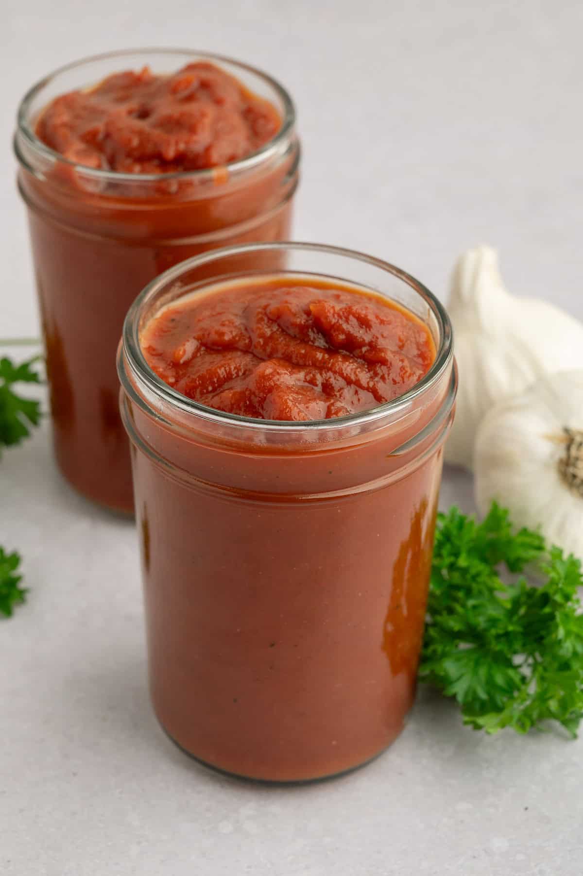Homemade no sugar tomato ketchup in mason jars.