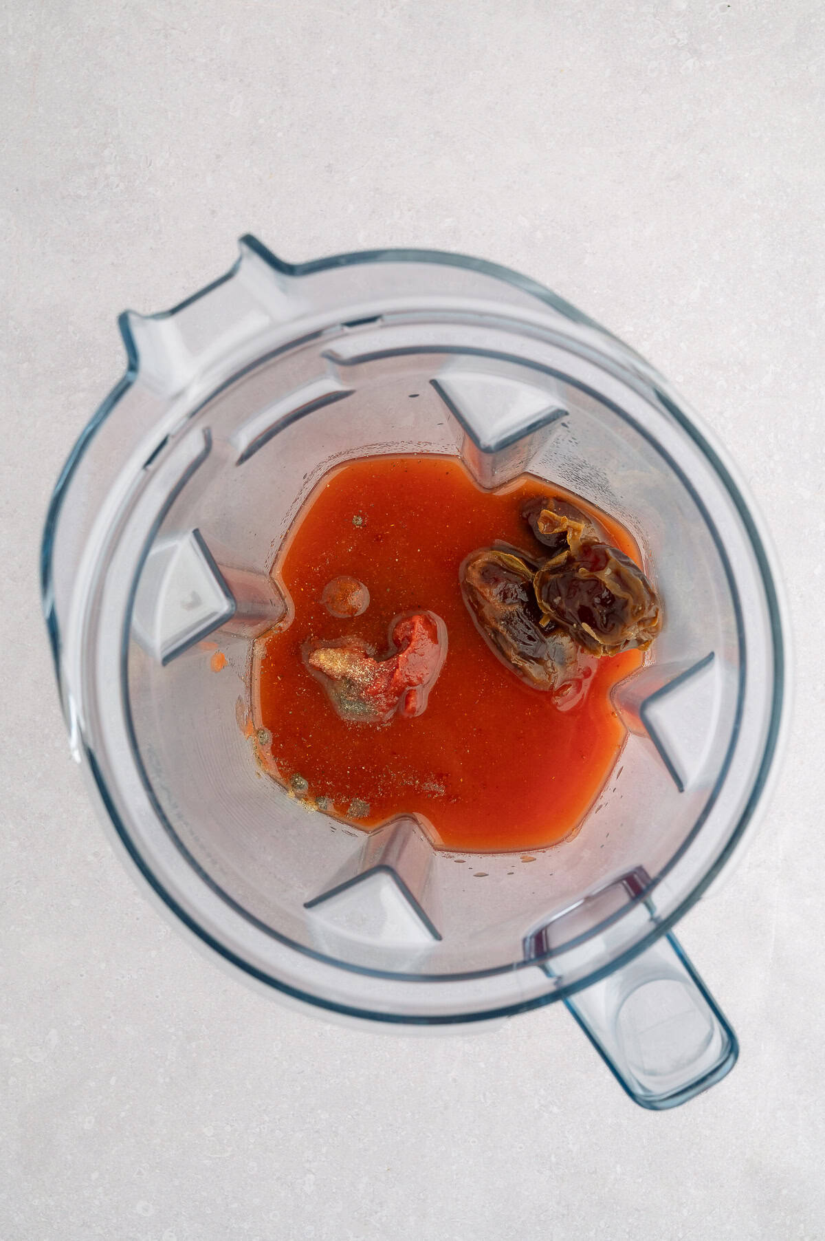 Blender containing all ketchup ingredients.