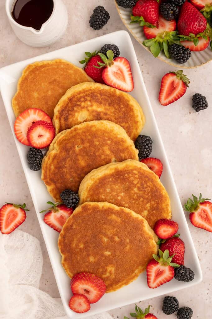 Platter with protein pancakes topped with berries.