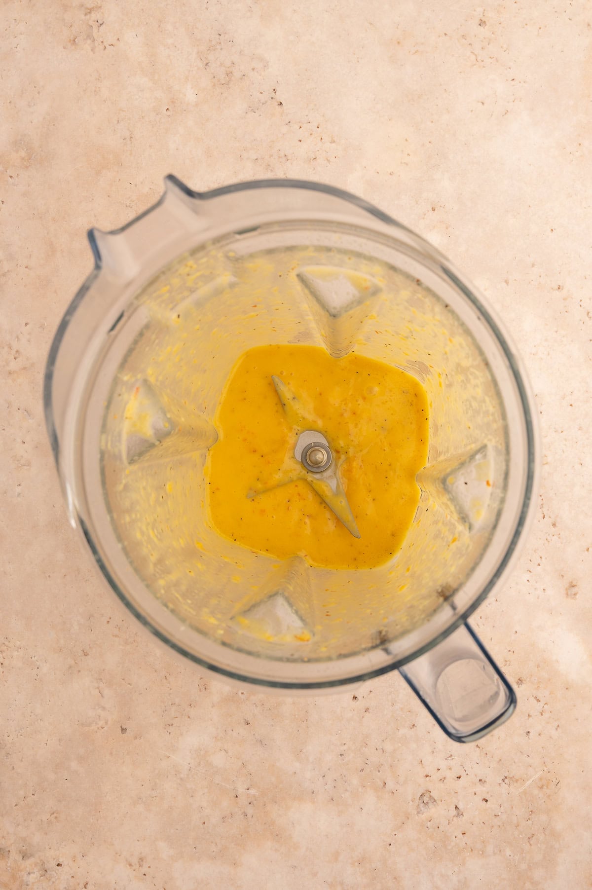 Salad dressing blended in a blender pitcher.