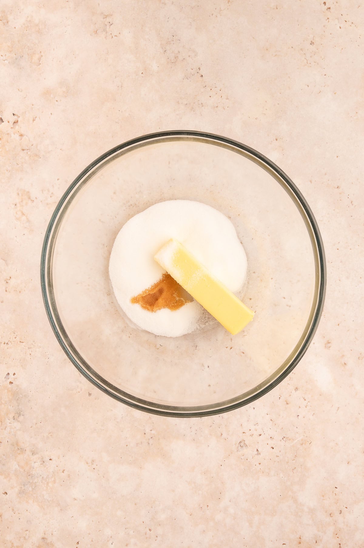 Creaming butter, sugar and vanilla in a mixing bowl.