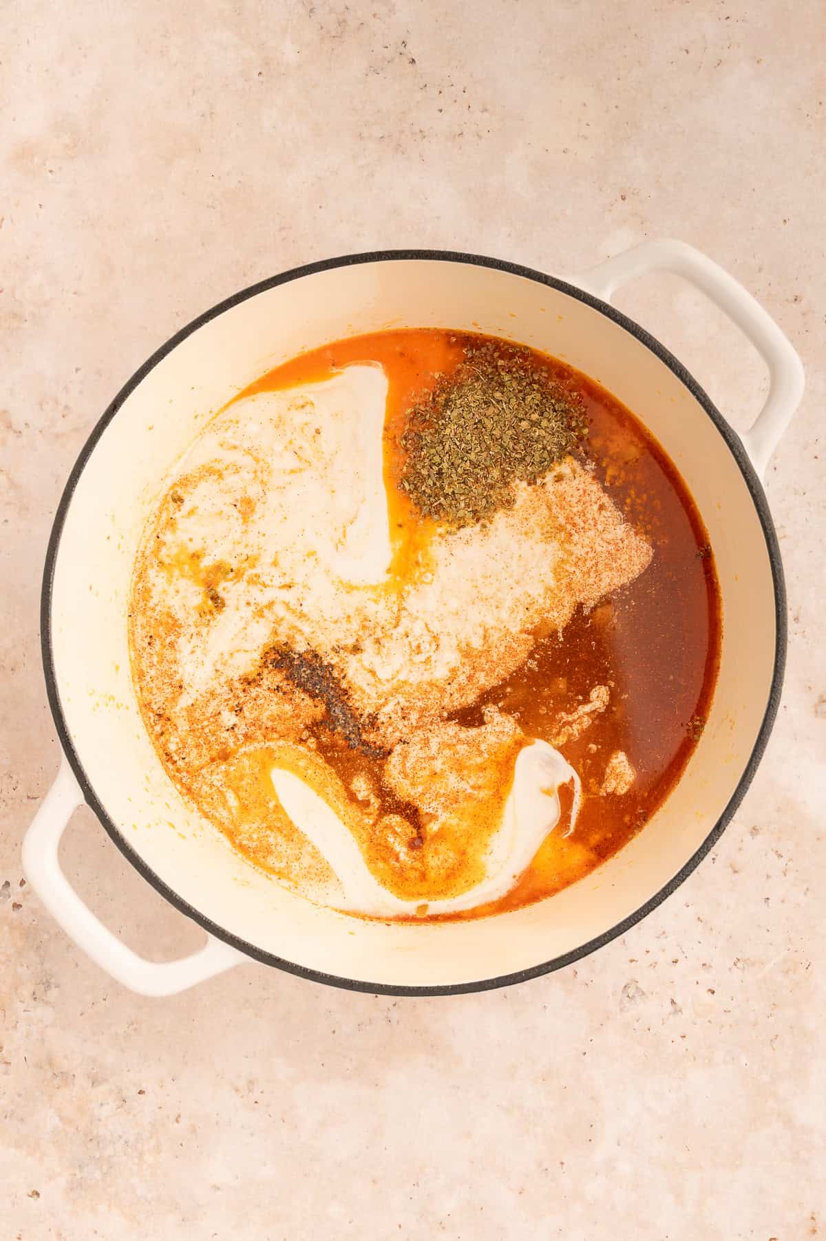 Herbs, spices, coconut milk, and broth added to the stock pot.