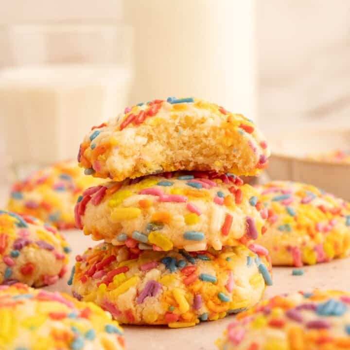 Stack of almond flour sugar cookies coated with sprinkles.