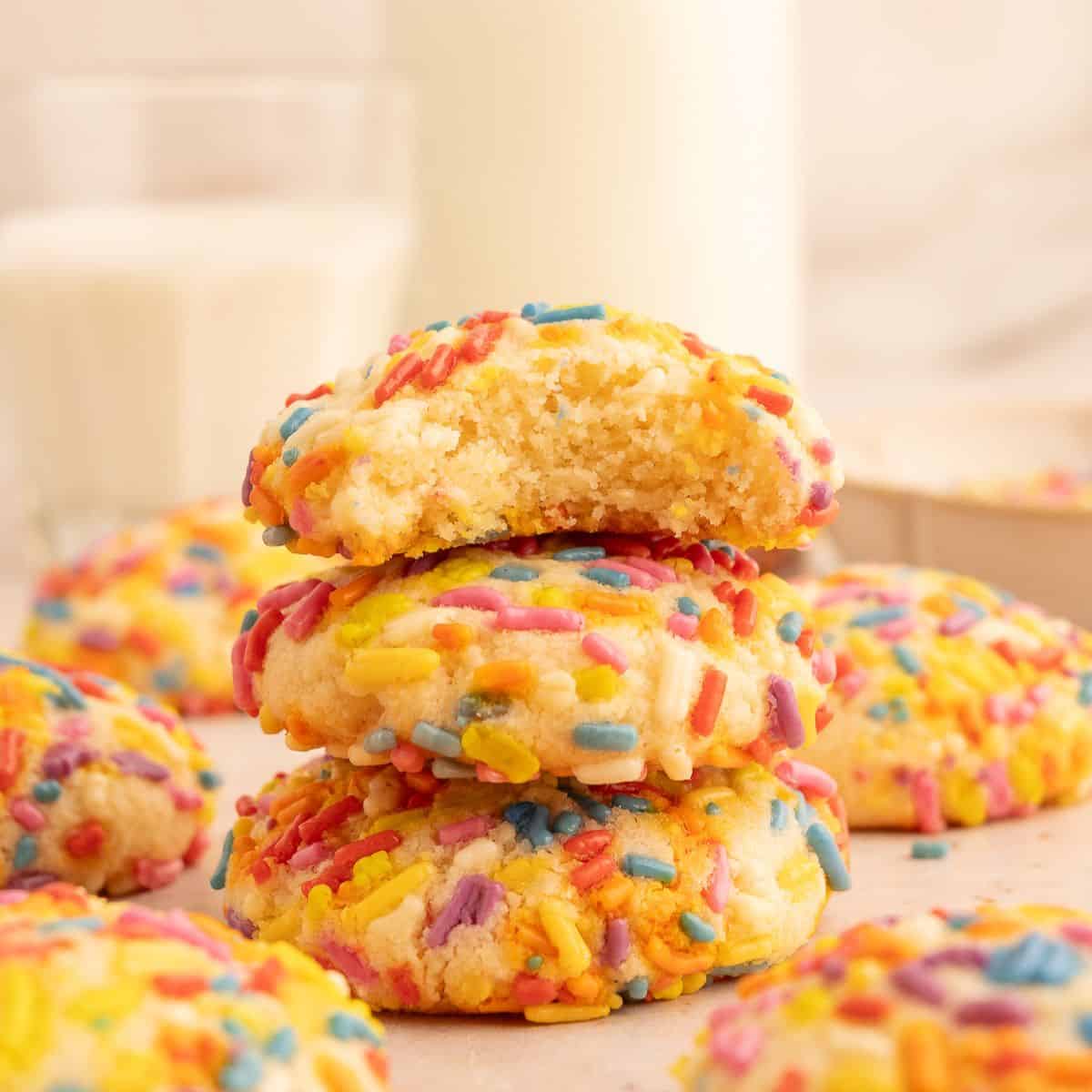 Stack of almond flour sugar cookies coated with sprinkles.
