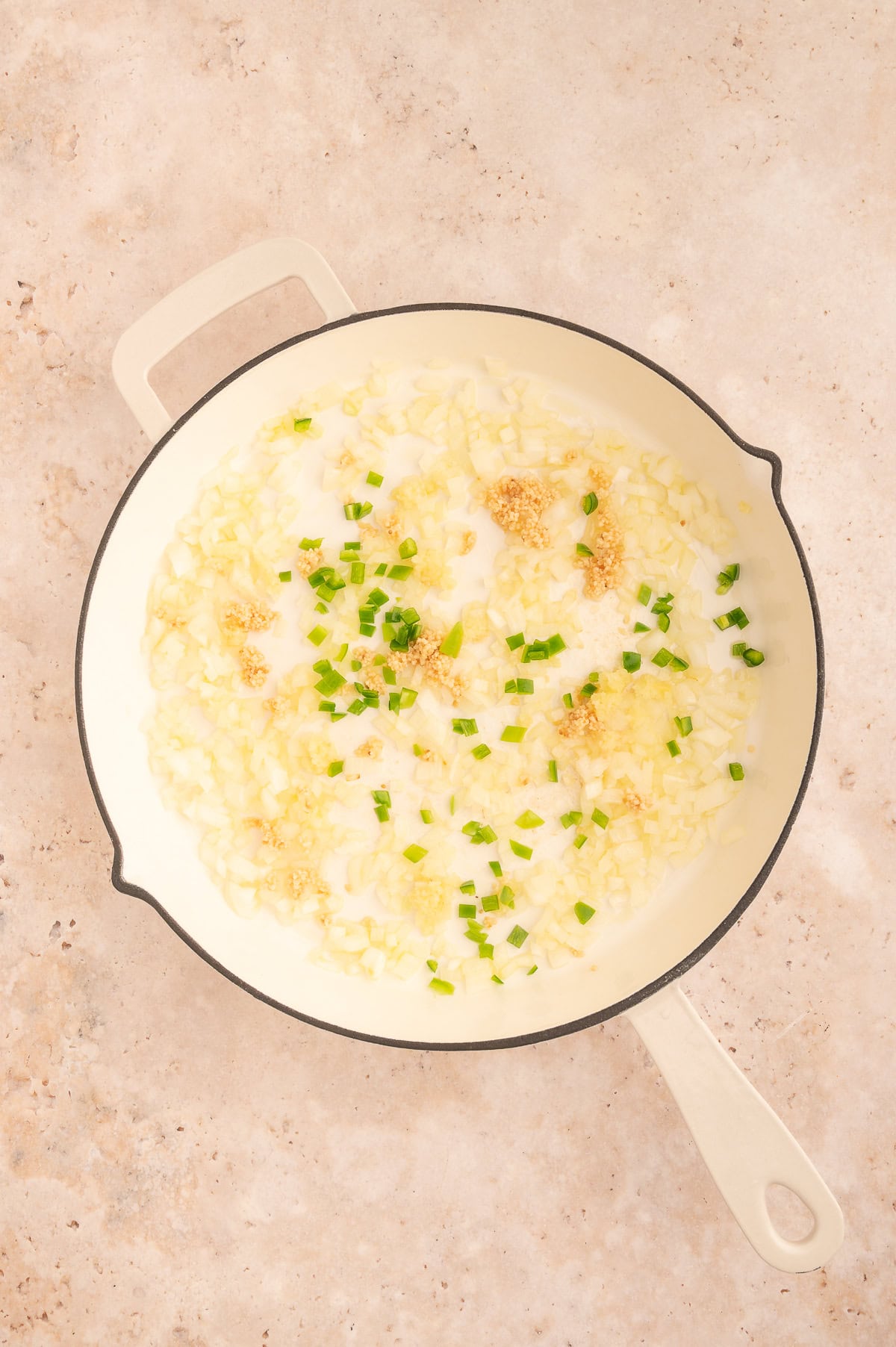 Ginger, garlic and Chile added to the skillet with the onions and garlic.