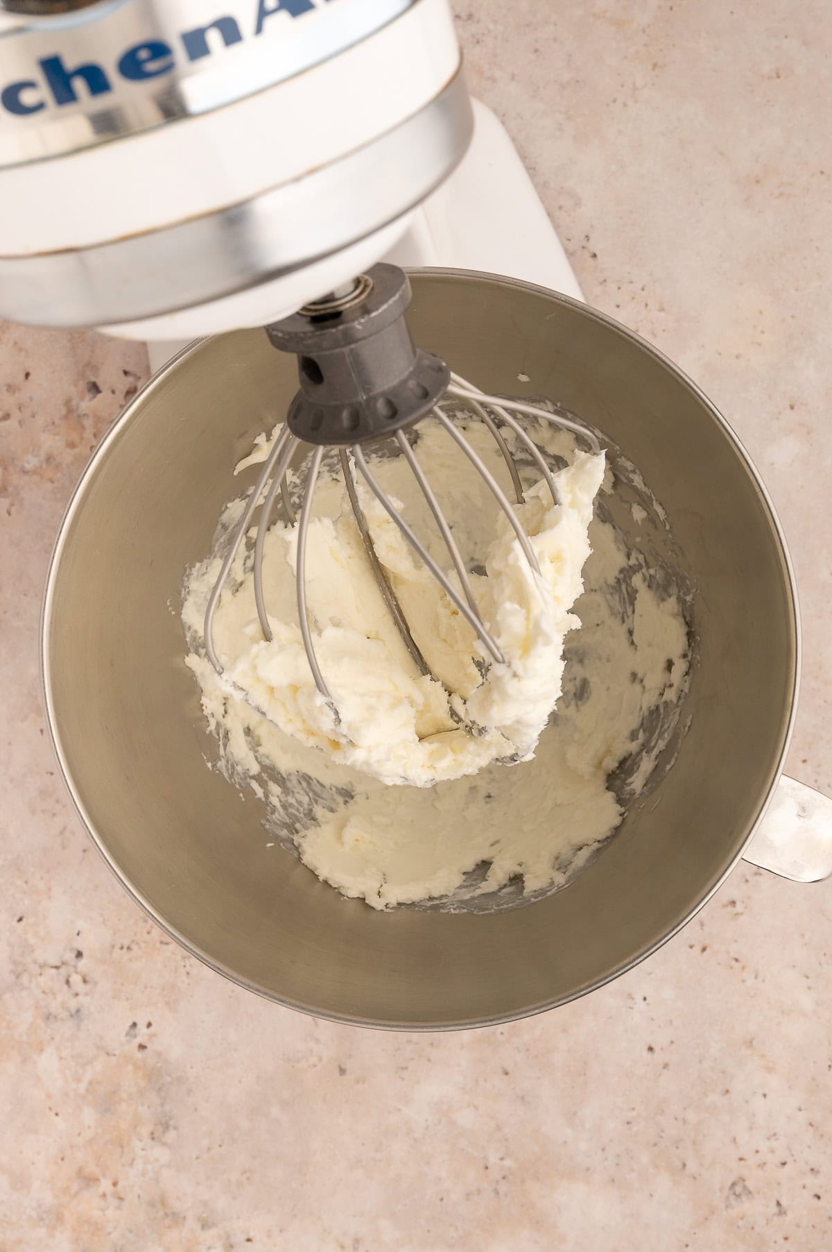 Whisk attachment blending smooth batter for healthy food recipes.